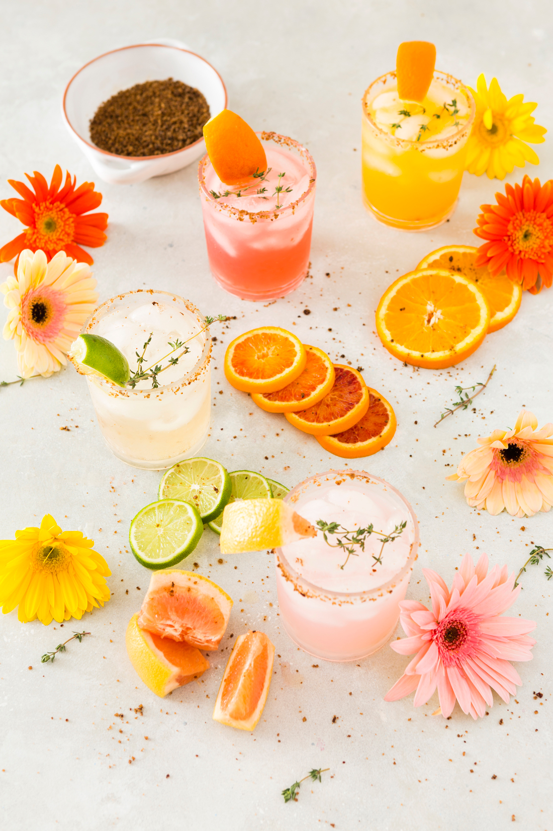  Citrus mezcal cocktails surrounded by florals